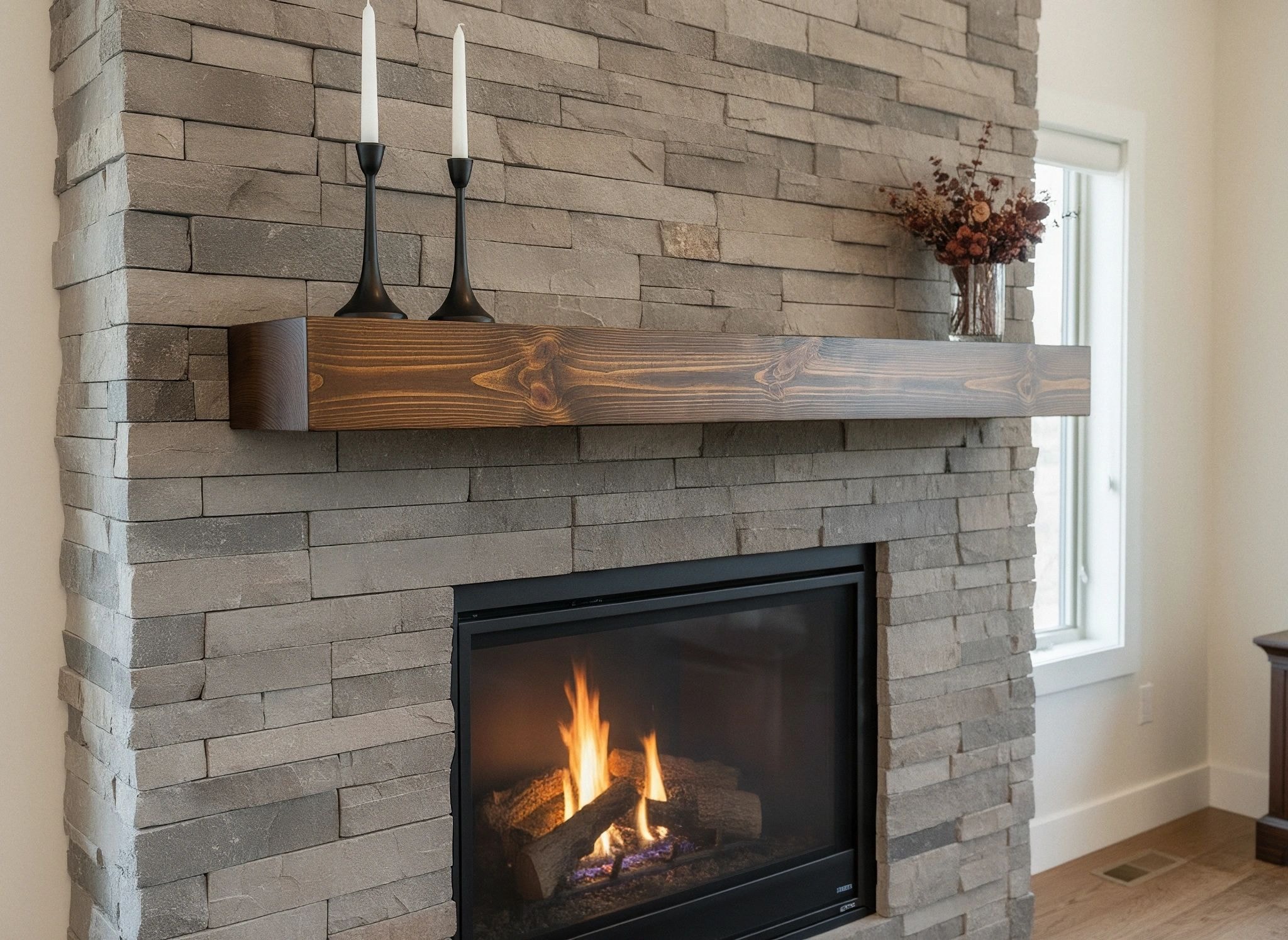Solid brown timber mantel against a pale stone fireplace