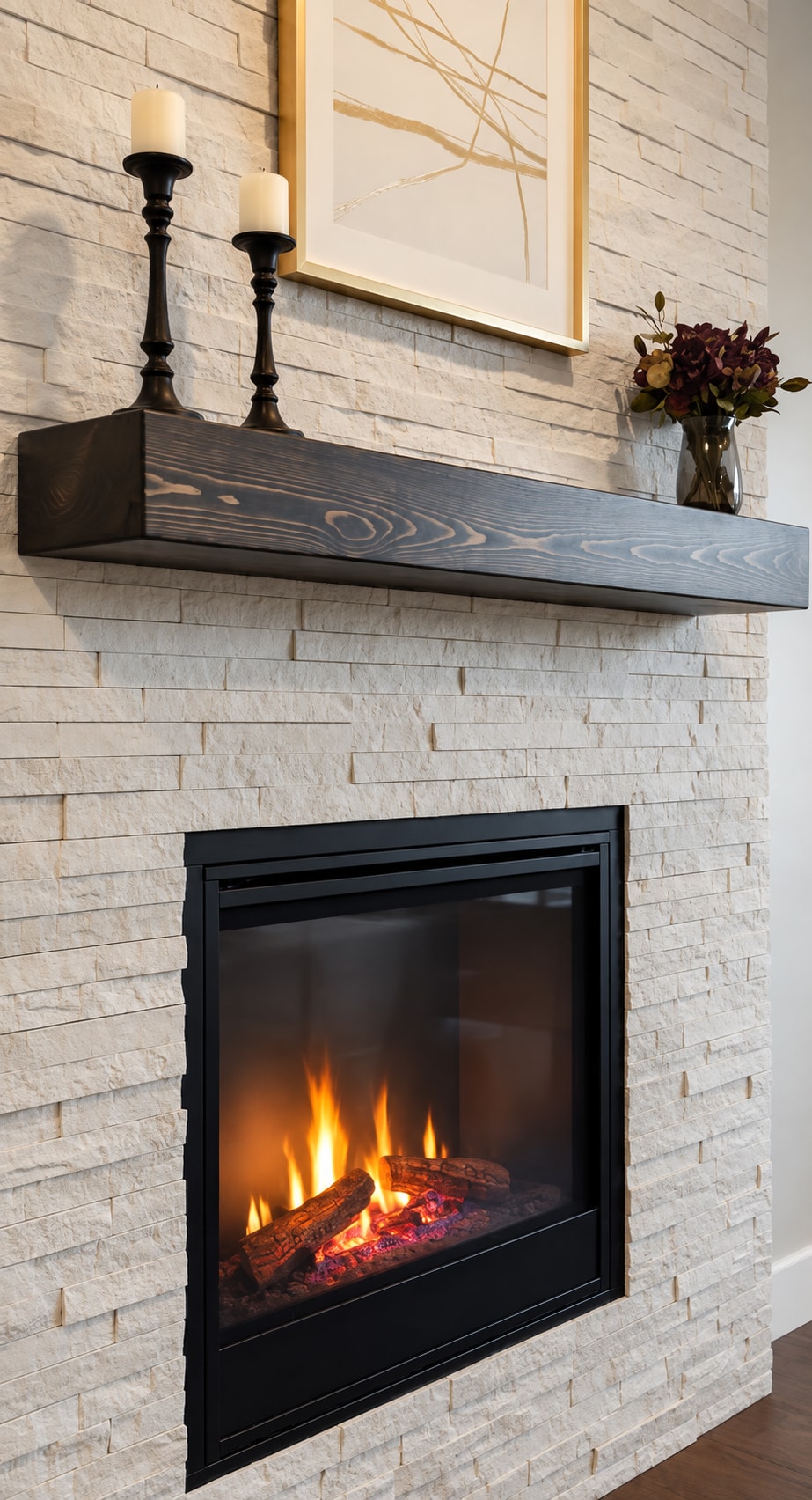 Dark timber mantel with candlesticks above a fireplace in a pale brick wall